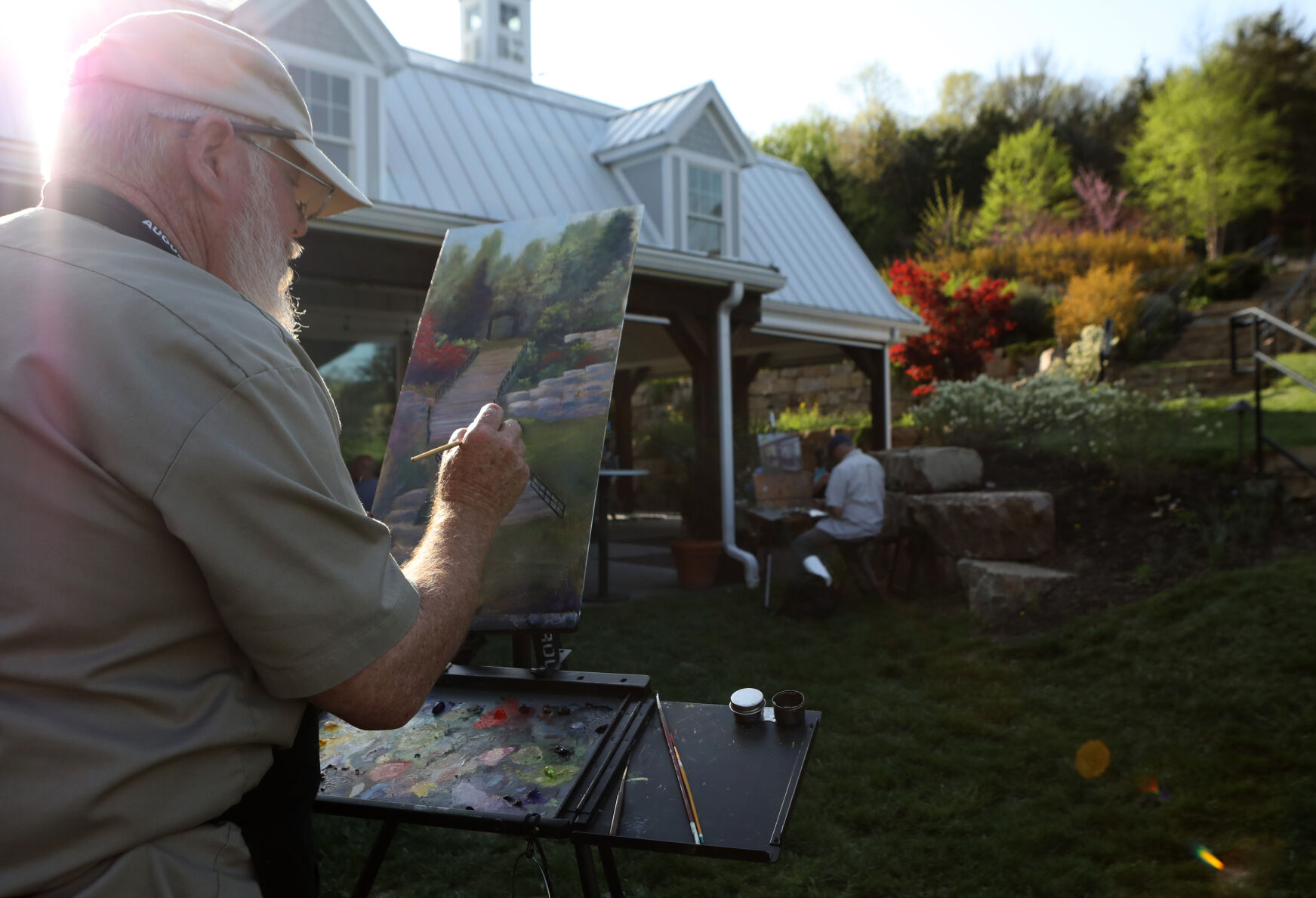 Mike Phelps works on an oil painting